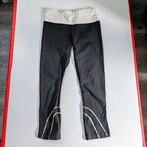 Lululemon athletic wear leggings black with white & pink pattern women's size 4